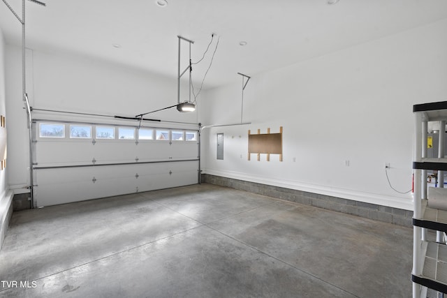 garage featuring electric panel and a garage door opener