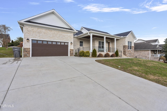 view of front of house featuring a garage and a front yard