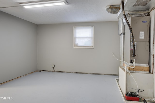 basement featuring a textured ceiling