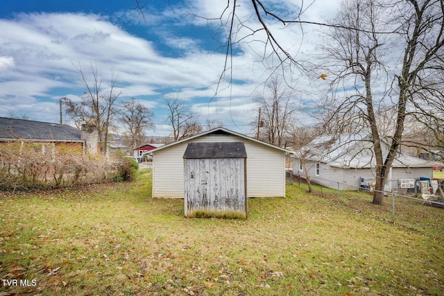 view of outbuilding with a yard