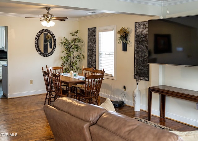 dining space featuring ceiling fan, crown molding, and dark wood-type flooring