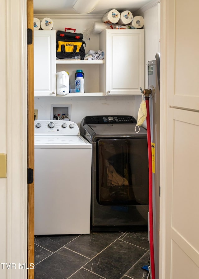 washroom featuring cabinets and separate washer and dryer