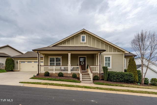 view of front of house featuring a porch and a garage