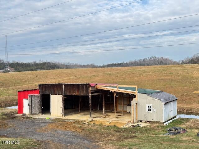 view of outbuilding with a rural view