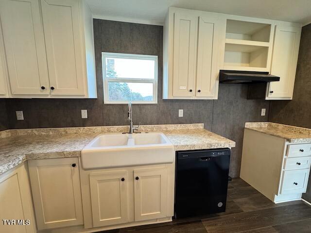 kitchen featuring dark hardwood / wood-style flooring, sink, white cabinetry, and black dishwasher