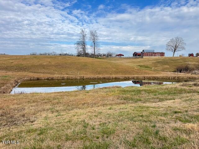 view of yard featuring a water view and a rural view