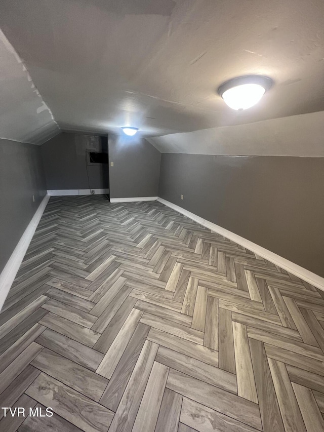 bonus room with parquet flooring