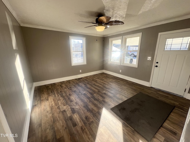 entryway featuring a textured ceiling, dark wood-type flooring, ceiling fan, and crown molding