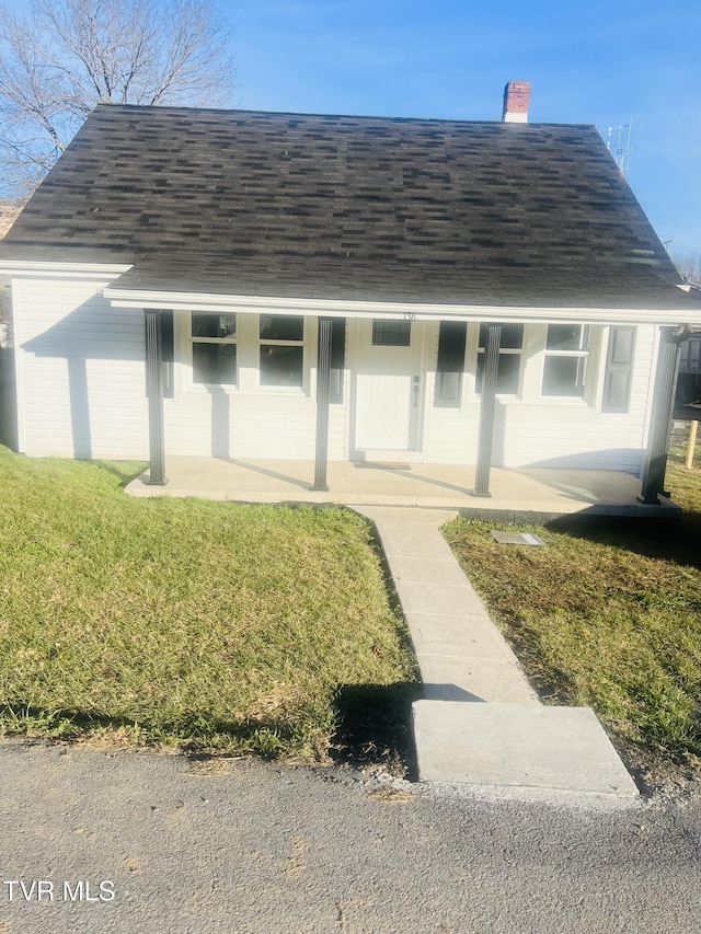 exterior space featuring a yard and a porch