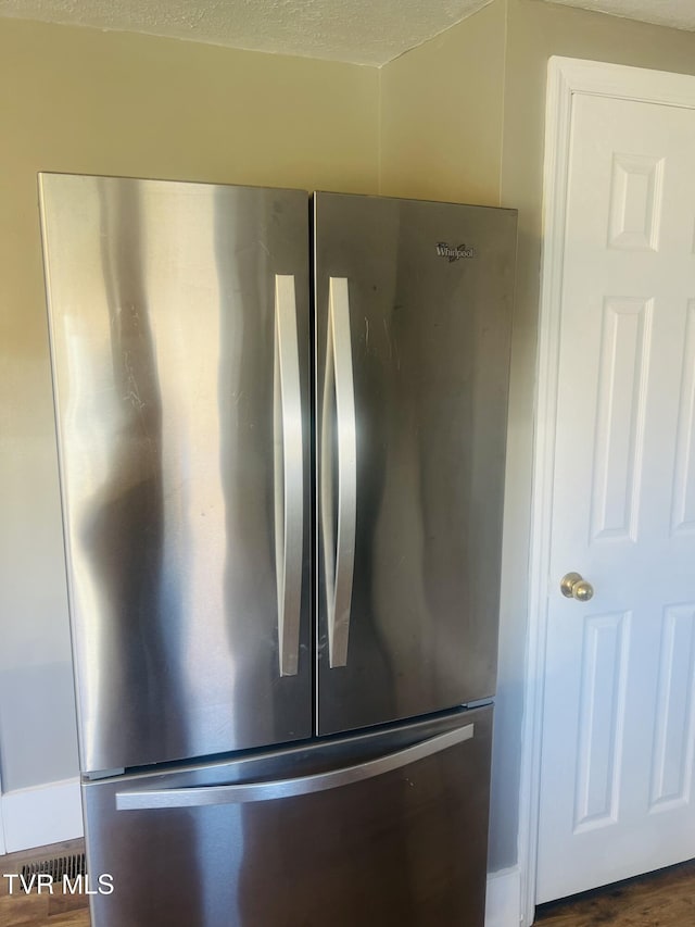 interior details featuring stainless steel fridge