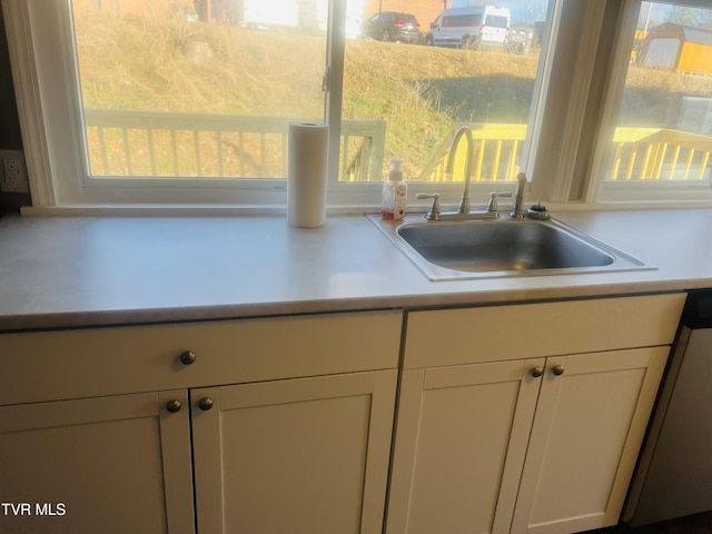 kitchen with dishwashing machine and sink