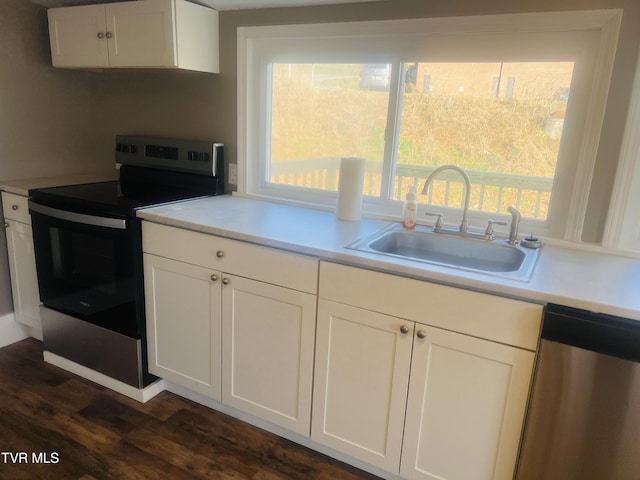 kitchen with sink, white cabinets, and stainless steel appliances