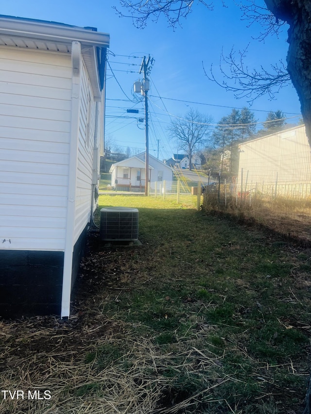 view of yard featuring central air condition unit