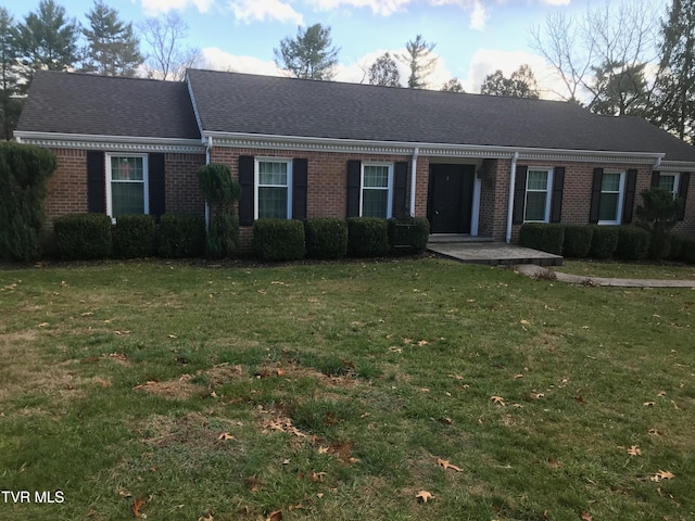 ranch-style home with a front yard