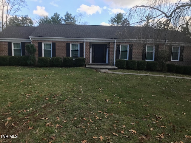 ranch-style home with a front lawn