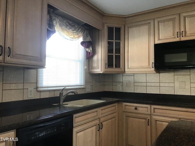 kitchen with black appliances, backsplash, dark stone counters, and sink