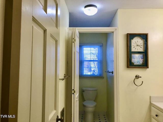 bathroom featuring toilet and vanity