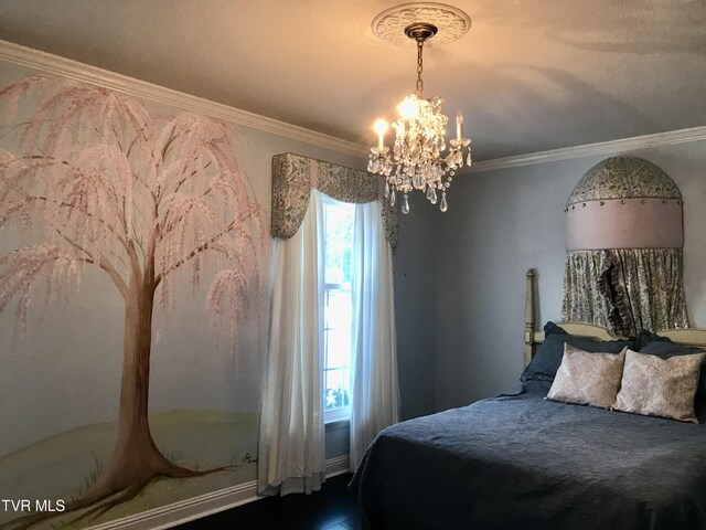 bedroom featuring a notable chandelier and crown molding