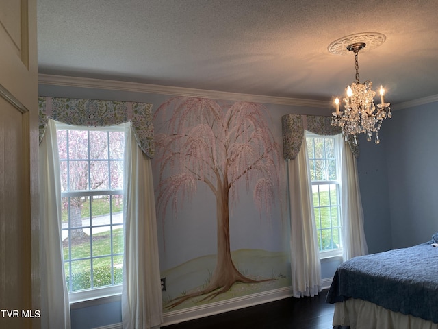 bedroom with multiple windows, crown molding, and an inviting chandelier