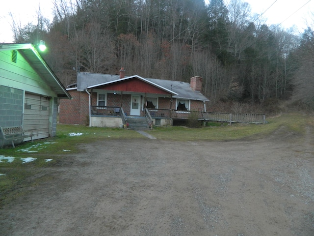 view of front of home with a garage and covered porch