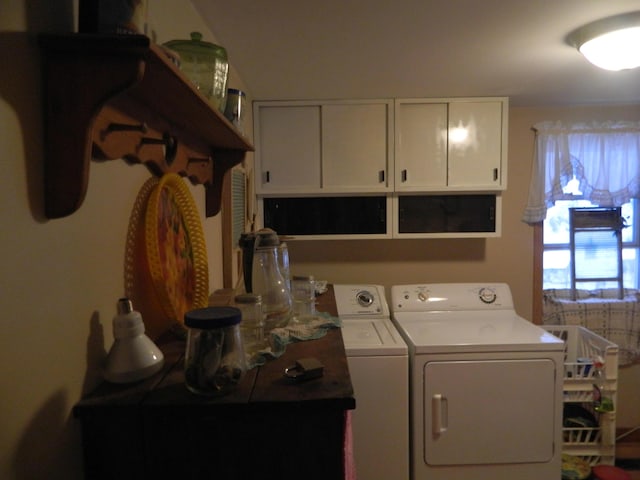 washroom with cabinets and independent washer and dryer