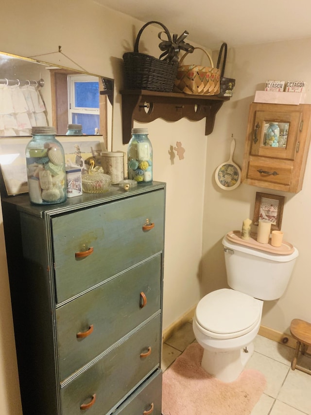 bathroom with tile patterned floors and toilet