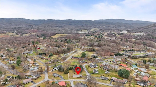 birds eye view of property with a mountain view