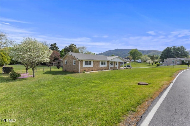 212 Mayflower Rd, Johnson City, TN 37601 - view of front of property featuring fence, crawl space, a front lawn, and a mountain view