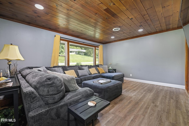 living room featuring hardwood / wood-style floors, wooden ceiling, and crown molding