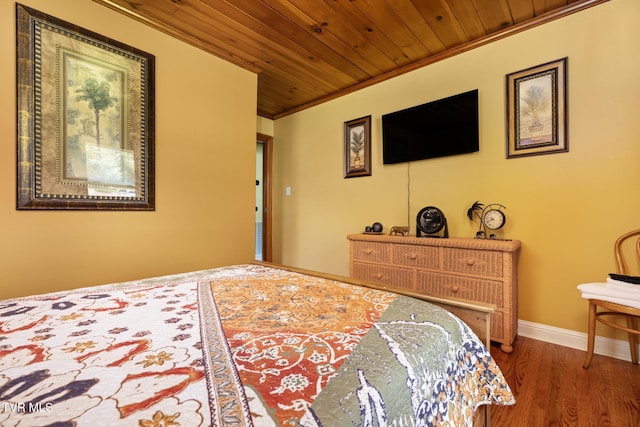 bedroom featuring hardwood / wood-style flooring, wood ceiling, and ornamental molding