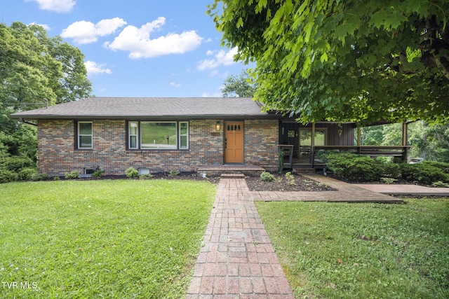 single story home with covered porch and a front yard