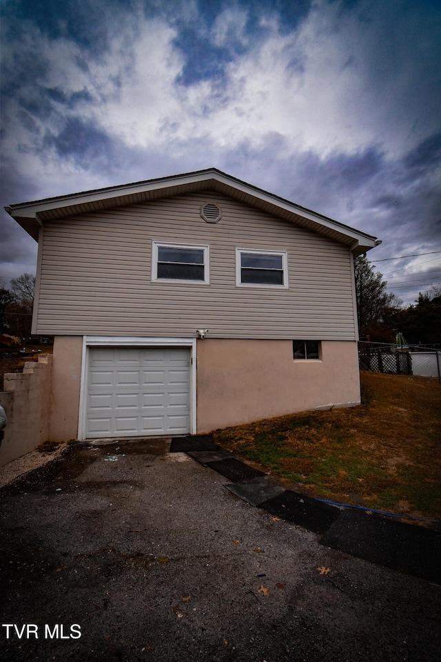 view of side of property featuring a garage