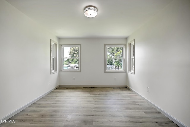 unfurnished room featuring light wood-type flooring