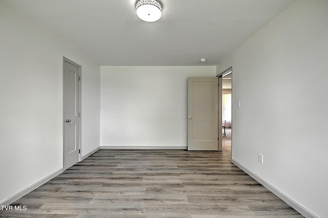 unfurnished room featuring light wood-type flooring