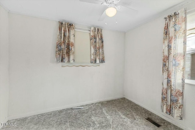 unfurnished room with carpet flooring and ceiling fan