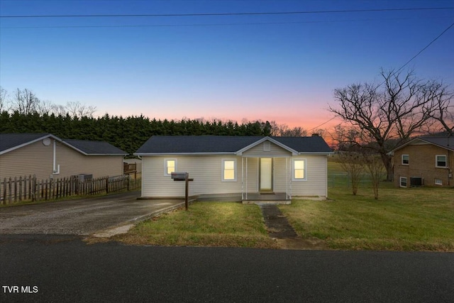 ranch-style house with a yard