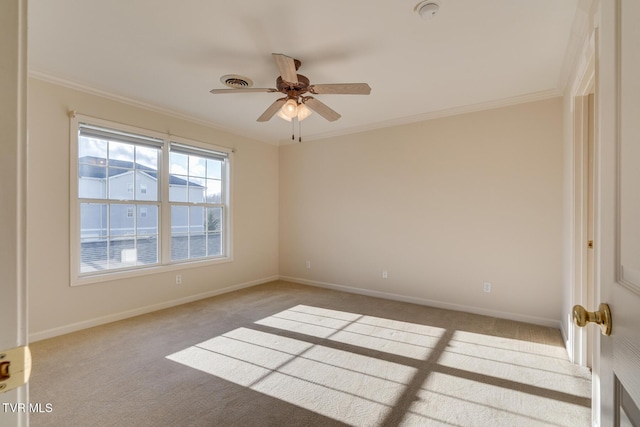 empty room with light carpet, crown molding, and ceiling fan