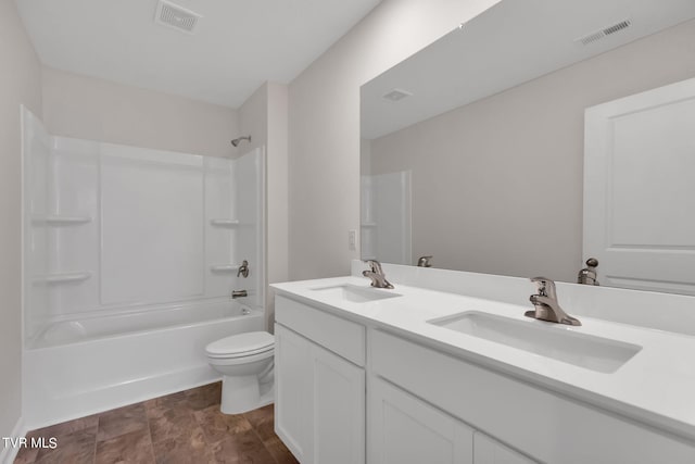 bathroom with toilet, visible vents, and a sink