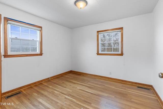 spare room featuring light wood-type flooring