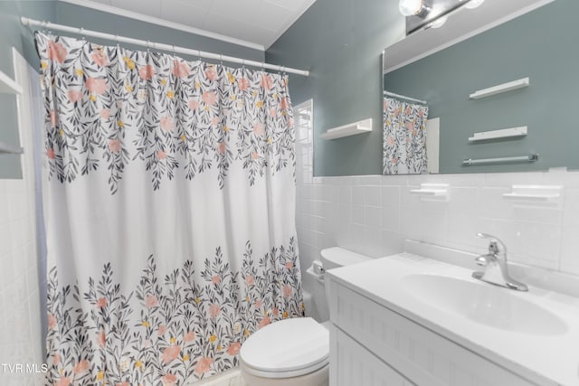 bathroom featuring tile walls, ornamental molding, vanity, walk in shower, and toilet