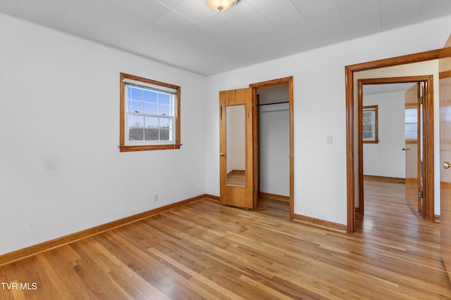 unfurnished bedroom with light wood-type flooring