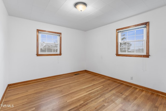 unfurnished room featuring light hardwood / wood-style flooring