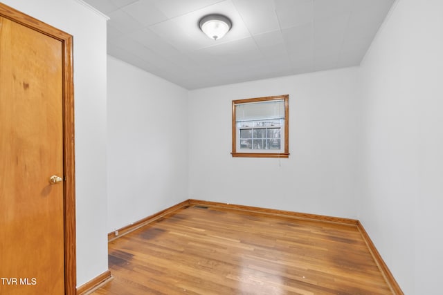 unfurnished room with light wood-type flooring