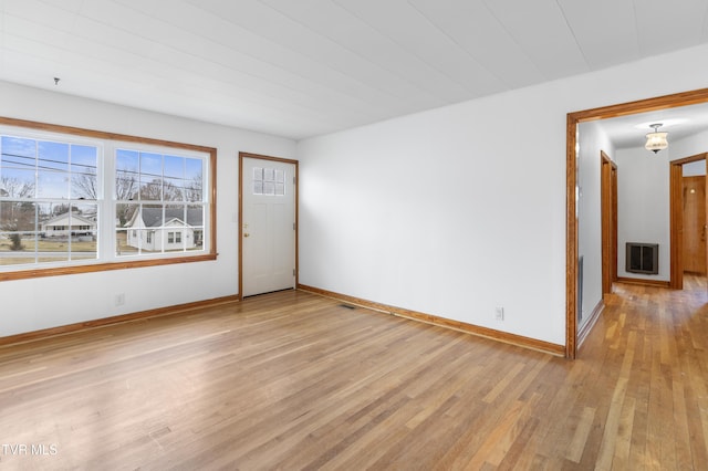 unfurnished room featuring light hardwood / wood-style floors