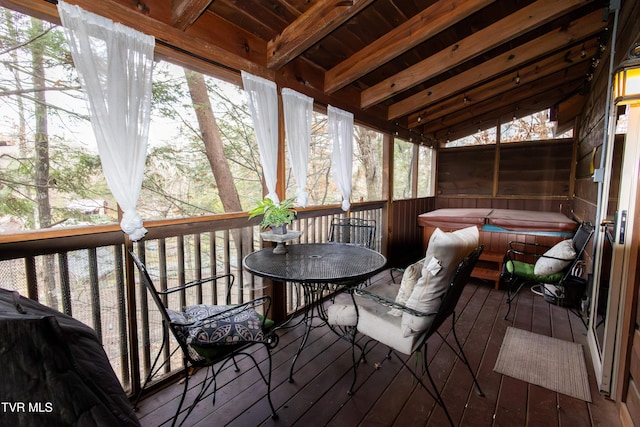 wooden deck featuring a hot tub