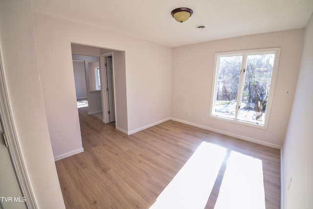 spare room featuring light wood-type flooring