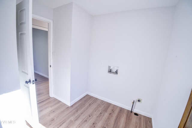 laundry area featuring hookup for an electric dryer, washer hookup, and light hardwood / wood-style floors