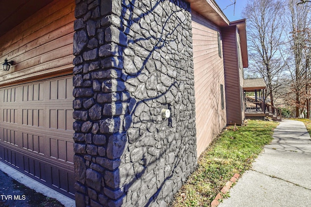 view of side of property featuring a garage