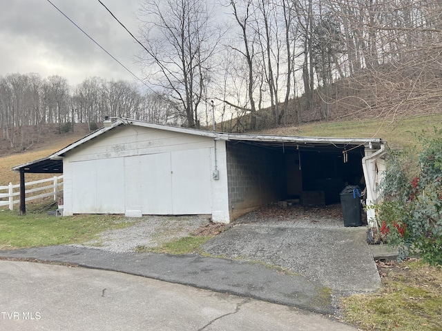 garage featuring a carport