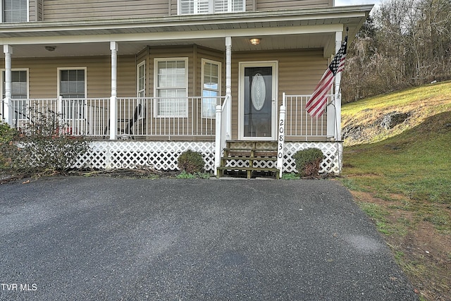 entrance to property with a porch